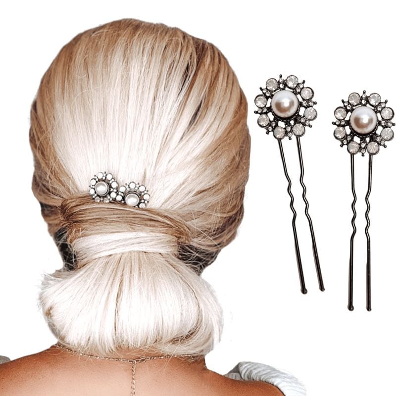 Two u-shaped hair pins with an antique pearl in the center, surrounded by a cluster of eight faux clear rhinestones. 
