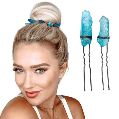 Two u-shaped hair pins with ocean blue color crystals attached at the top with fine wire.
